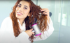 A woman blowing her hair with a 35mm accelerator blow dryer.