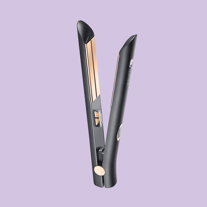 Black infrared flat iron, a plate measuring one inches with rose gold color plate, elegant details, on light purple background